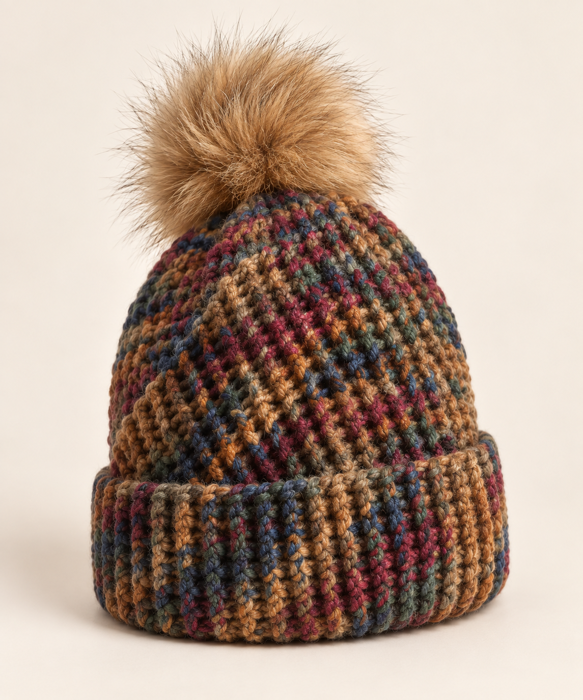 Styled preview of a multicolored knitted hat with a pompom