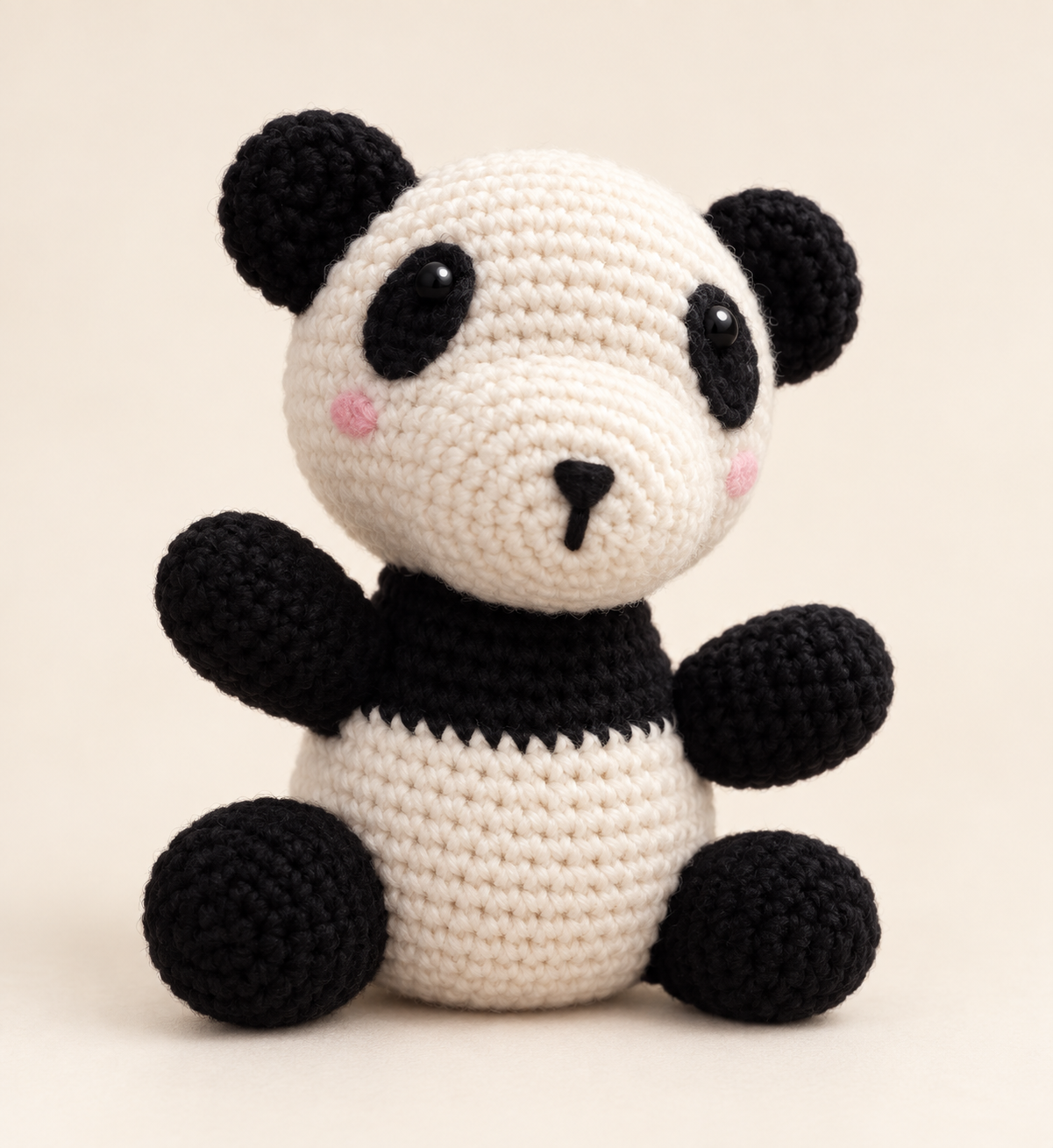 Styled preview of a black and white crochet panda plush